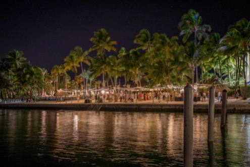 shot of amara cay resort from across the water at night